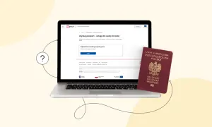 Czy można wyrobić paszport online? Na laptopie widać stronę gov.pl z informacją o uzyskaniu paszportu. Obok leży czerwony paszport.