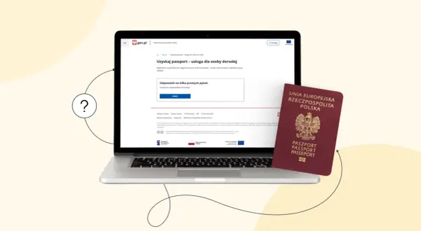 Czy można wyrobić paszport online? Na laptopie widać stronę gov.pl z informacją o uzyskaniu paszportu. Obok leży czerwony paszport.